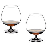 Riedel - Riedel Vinum Brandy Glass - Set of 2 - These Riedel Cognac/Brandy snifters are made of 24-percent lead crystal. The bulbous balloon-style bowl on each glass is specifically shaped for drinkers to cup the bottom and warm the brandy or cognac with one hand. Coupled with the narrower rim on the glass, the bowl is also designed to waft the liquor's aroma to the nose with each sip. These glasses come in a set of 2.