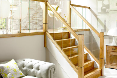 This is an example of a medium sized traditional mezzanine living room in Cheshire with beige walls, no fireplace, no tv and white floors.