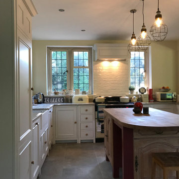 Traditional, bright kitchen with upcycled island