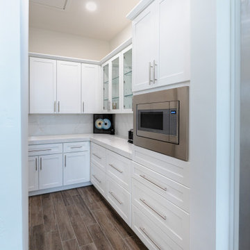 Modern White Shaker Kitchen with Oversized Island & Custom Storage Solutions