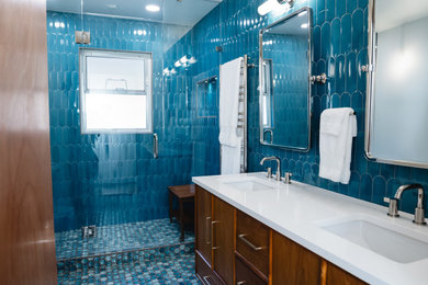 Inspiration for a mid-sized mid-century modern 3/4 ceramic tile double-sink alcove shower remodel in Seattle with beaded inset cabinets, medium tone wood cabinets, quartz countertops, white countertops and a freestanding vanity