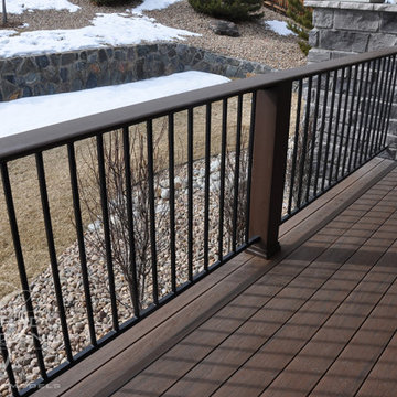 Castle Rock Covered Deck with Fireplace and Iron Railing