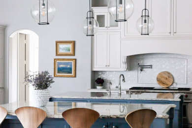 Example of a large transitional dark wood floor and brown floor open concept kitchen design in Dallas with a single-bowl sink, shaker cabinets, white cabinets, granite countertops, white backsplash, ceramic backsplash, stainless steel appliances, two islands and gray countertops
