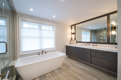 Photo of a mid-sized country master bathroom in Detroit with flat-panel cabinets, medium wood cabinets, a freestanding tub, an alcove shower, a two-piece toilet, multi-coloured tile, porcelain tile, white walls, porcelain floors, an undermount sink, engineered quartz benchtops, multi-coloured floor, a hinged shower door, white benchtops, a shower seat, a single vanity and a floating vanity.