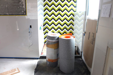 Example of a large trendy multicolored tile and porcelain tile bathroom design in Orange County with white walls