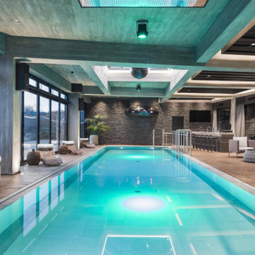Pool area of Icelandic retreat with smart lighting above and inside the pool.