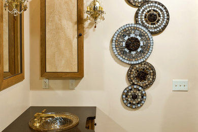 Example of a mid-sized eclectic multicolored tile and mosaic tile travertine floor bathroom design in Philadelphia with beige walls and solid surface countertops