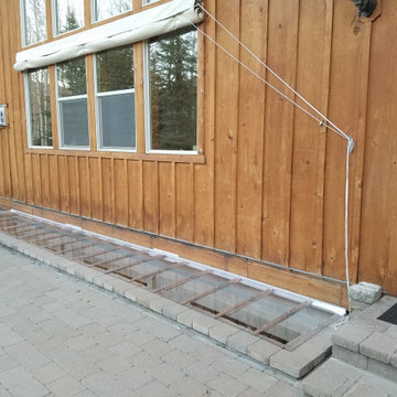 Custom basement well covers for a villa