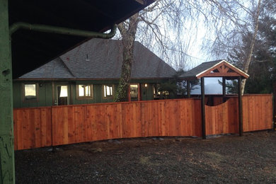 Mid-sized arts and crafts wood gable roof photo in Other with a shingle roof