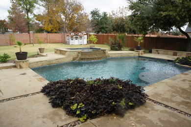 Inspiration for a mid-sized timeless backyard concrete and rectangular lap hot tub remodel in Dallas