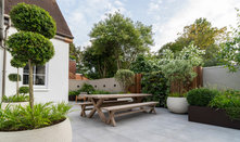 Leafy Outdoor Rooms Create an Inviting Backyard for Entertaining