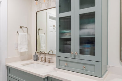 Mid-sized elegant kids' gray tile and porcelain tile porcelain tile, white floor and double-sink bathroom photo in New York with shaker cabinets, blue cabinets, a two-piece toilet, beige walls, an undermount sink, quartz countertops, white countertops and a built-in vanity