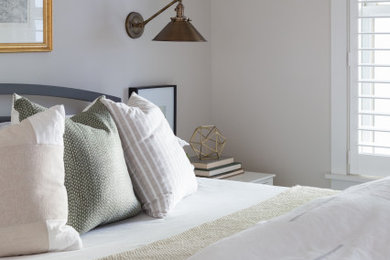 Example of a transitional bedroom design in Burlington