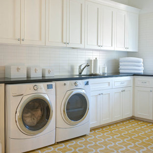 Design ideas for a traditional utility room in Dallas with yellow floors.