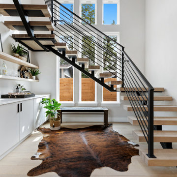 Warm & Welcoming Bar Under Floating Stairs