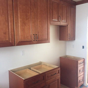 Traditional cinnamon glaze kitchen cabinets