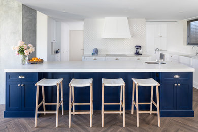 Traditional kitchen in Perth with shaker cabinets, blue cabinets, quartz benchtops, white splashback, ceramic splashback, multiple islands and grey benchtop.