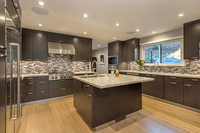 Design ideas for a mid-sized contemporary u-shaped eat-in kitchen in San Francisco with an undermount sink, flat-panel cabinets, dark wood cabinets, marble benchtops, multi-coloured splashback, glass tile splashback, stainless steel appliances and with island.