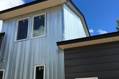 Inspiration for a modern metal exterior home remodel in New York