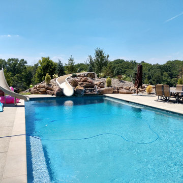 Estate Poolside Landscape & Hardscape Retreat with Custom Waterfeature
