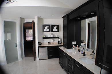 Example of a large transitional master beige tile marble floor walk-in shower design in Orlando with shaker cabinets, black cabinets, a two-piece toilet, white walls, an undermount sink and quartzite countertops