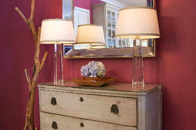 Inspiration for a mid-sized timeless medium tone wood floor hallway remodel in New York with red walls