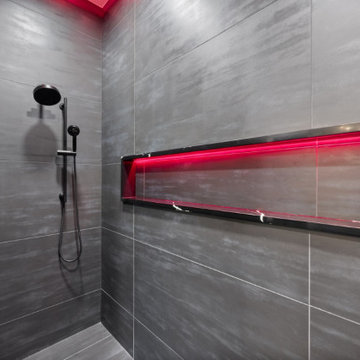 Dual Showerheads and Backlit Niche in Dark Tile Shower