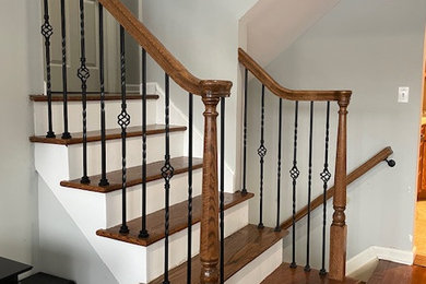 Small elegant wooden straight mixed material railing staircase photo in New York with wooden risers