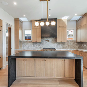Timeless Style with Matte Black Counters and White Oak Cabinets