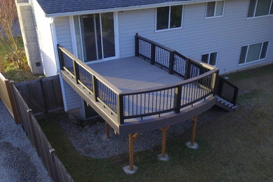 Photo of a mid-sized contemporary backyard deck in Seattle with no cover.