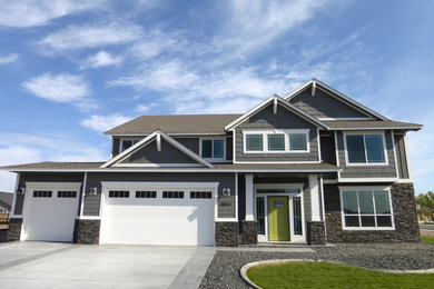 Design ideas for a two-storey grey exterior in Seattle with vinyl siding.