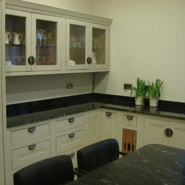 Cream handmade kitchen with glazed cabinets and large island