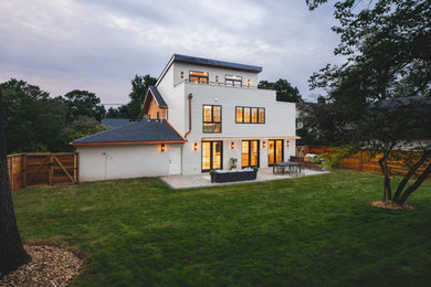 Transitional three-story concrete fiberboard house exterior idea in DC Metro
