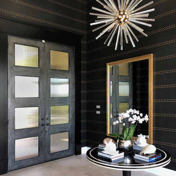 Phillip Jeffries "Rivets" grasscloth wallpaper in the entry foyer