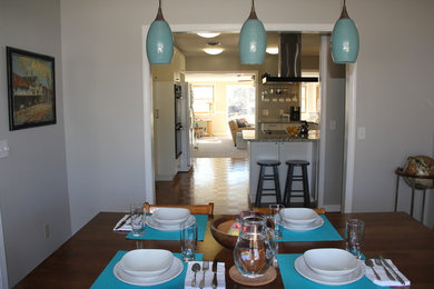 Example of a transitional dining room design in Other