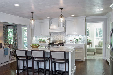 This is an example of a mid-sized traditional single-wall kitchen in Atlanta with an undermount sink, beaded inset cabinets, white cabinets, quartzite benchtops, grey splashback, glass sheet splashback, stainless steel appliances and dark hardwood floors.