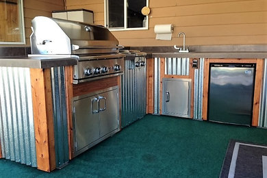 Inspiration for a rustic patio remodel in Portland with a roof extension