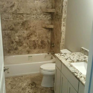 Philadelphia Travertine and D'argento marble bathrooms