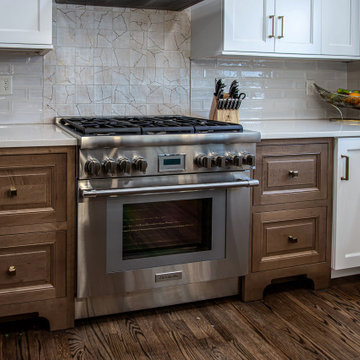 Two Tone Kitchen with Floating Shelves and Island Seating and Updated Fireplace