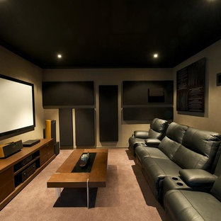 Photo of a small modern enclosed home cinema in Perth with brown walls, carpet and a projector screen.