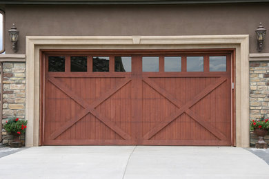 Garage - mid-sized transitional attached two-car garage idea in Denver