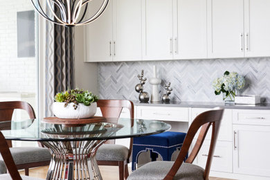 Large transitional light wood floor and brown floor kitchen/dining room combo photo in Other with white walls