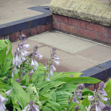 Stone/ brick etc landscape elements.