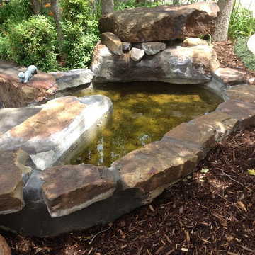 The concrete patchwork just wasn't going to work! upper pond.