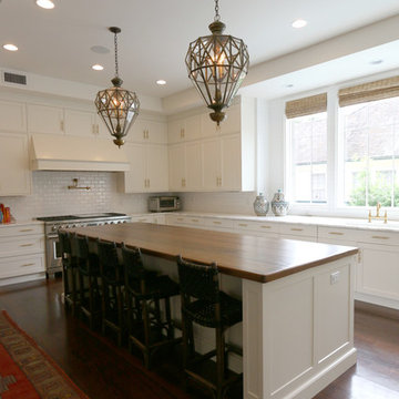 Recessed Cabinet Doors, Wood Island Countertop, and A Custom Hood Defines Style