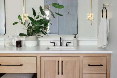Inspiration for a mid-sized modern master green tile and subway tile ceramic tile and multicolored floor bathroom remodel in Dallas with furniture-like cabinets, light wood cabinets, a one-piece toilet, green walls, an undermount sink, quartzite countertops, a hinged shower door, white countertops, a niche and a built-in vanity