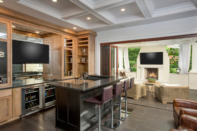 Seated home bar - mid-sized industrial u-shaped ceramic tile seated home bar idea in Columbus with an undermount sink, shaker cabinets, granite countertops and mirror backsplash