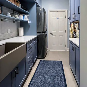 Laundry Room with Blue Painted Cabinetry and Sparkling White Quartz Countertops