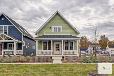 Mid-sized arts and crafts two-storey green house exterior in Indianapolis.