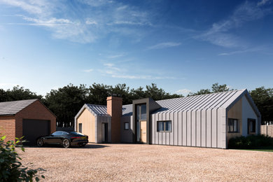 Large modern bungalow front detached house in Other with metal cladding, a pitched roof, a metal roof and a grey roof.